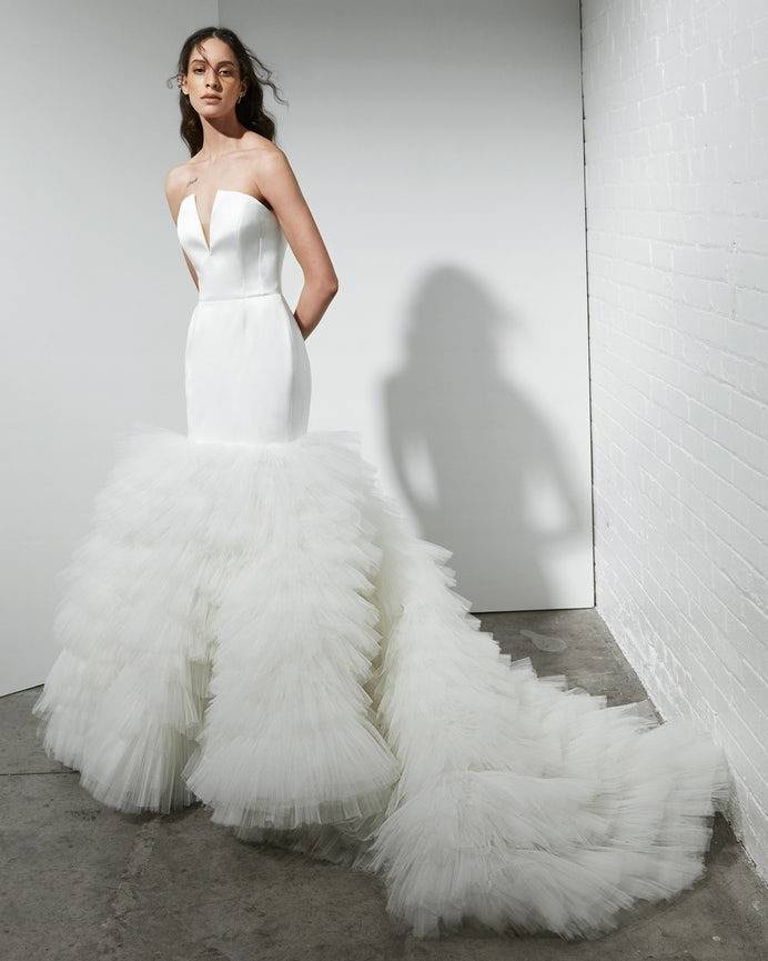 Rivini by Rita Vinieris modern strapless wedding dress with dramatic tiered tulle skirt with extended train