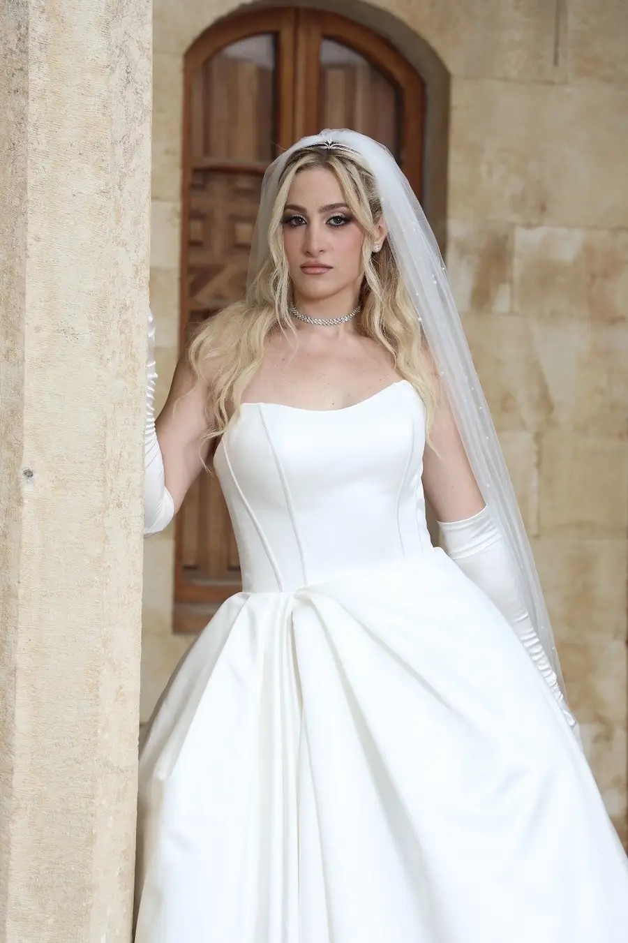 Lorraine Wears Minimalist Strapless Ball Gown Wedding Dress. Mobile Image