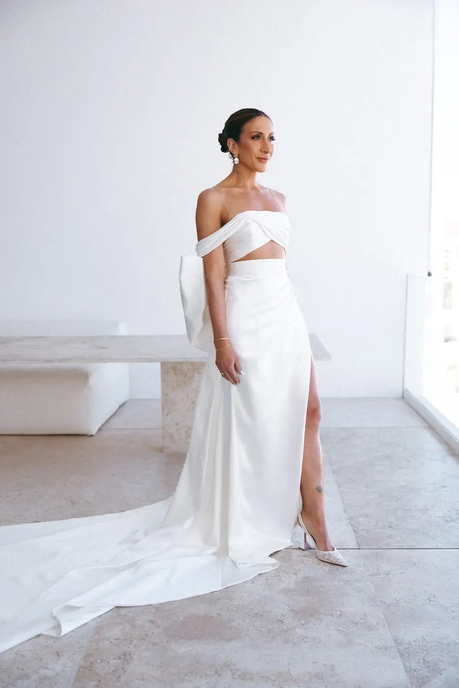 Nicole Wears Modern, Asymmetrical Bridal Dress for Destination Wedding. Desktop Image