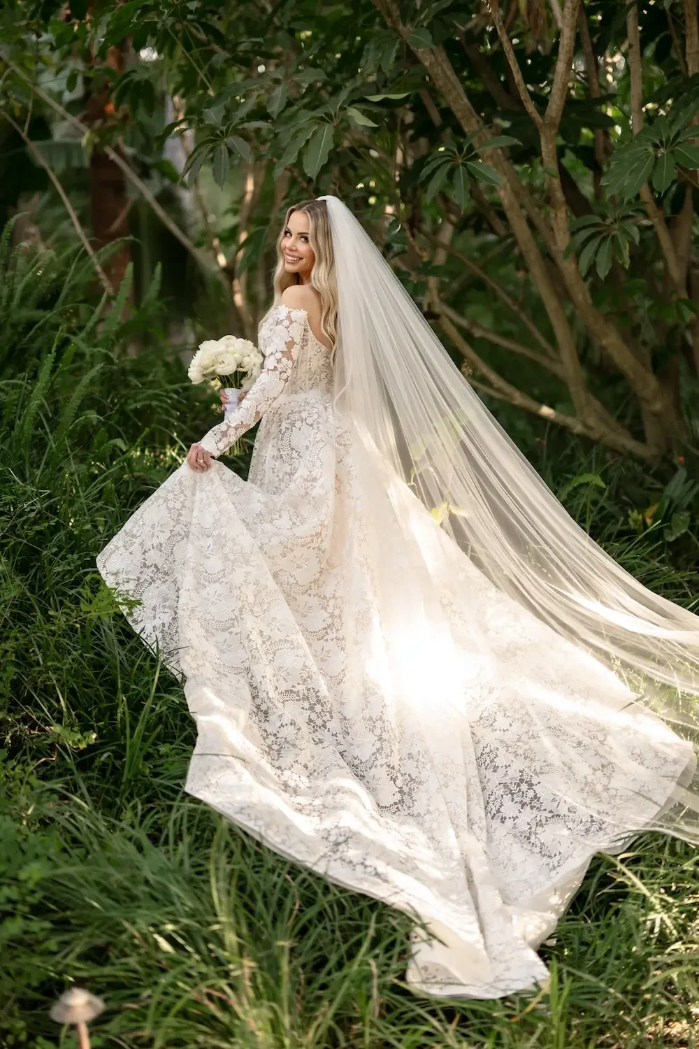 Kelsey Wears Lace Wedding Dress with Off the Shoulders Sleeves. Mobile Image