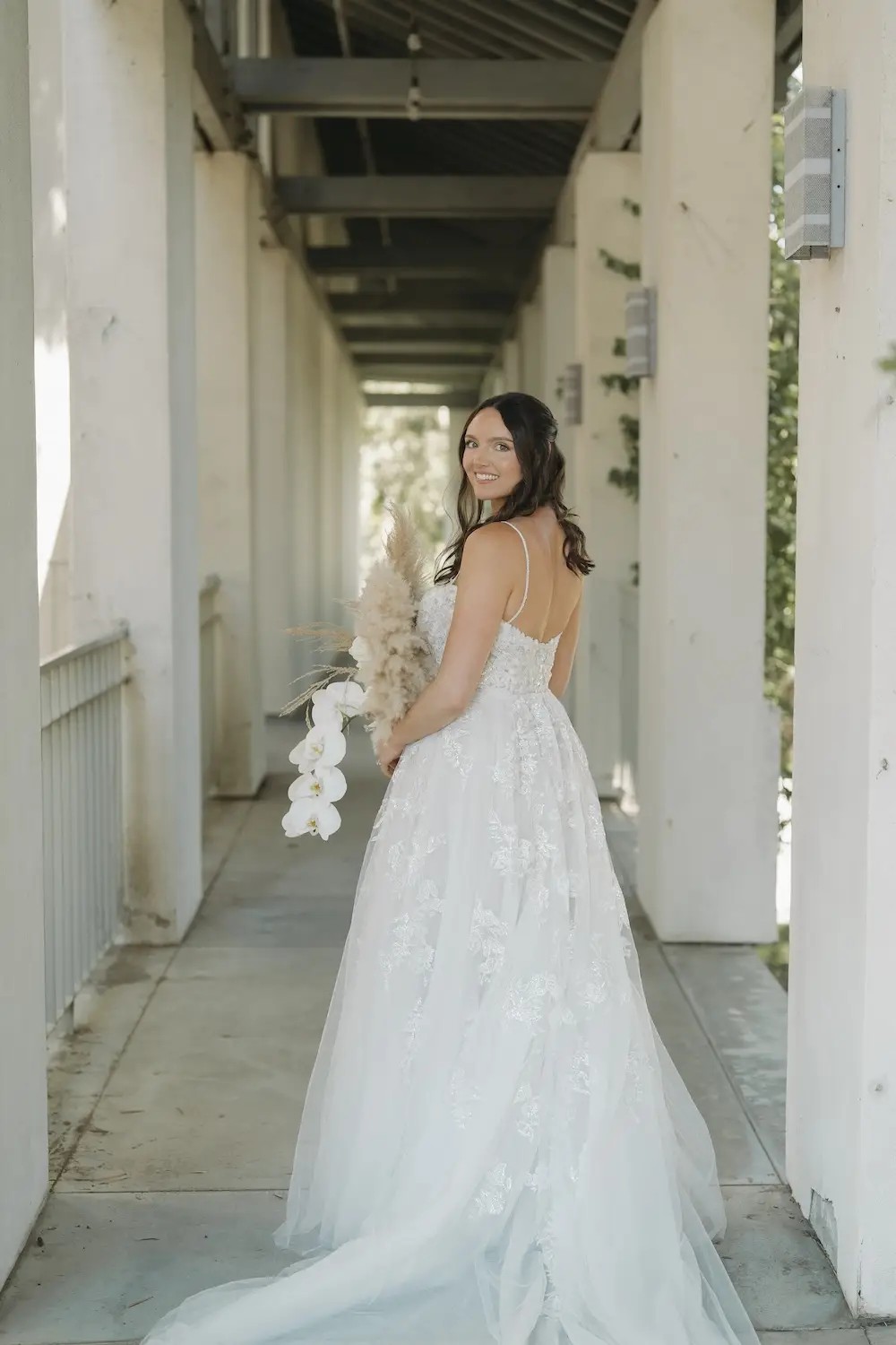 Amber Wears Two Floral Lace Detailed Wedding Dresses. Desktop Image